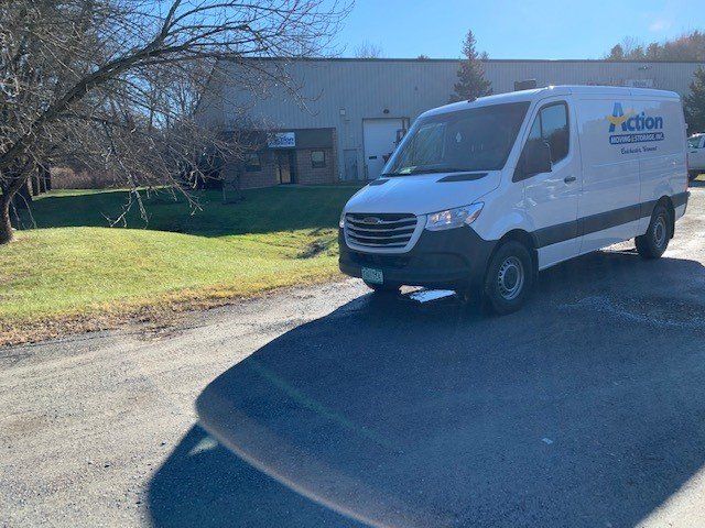 Moving Van In Front Of A Building — Colchester, VT — Action Moving & Storage, Inc