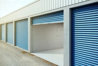 A row of storage units with their doors open.