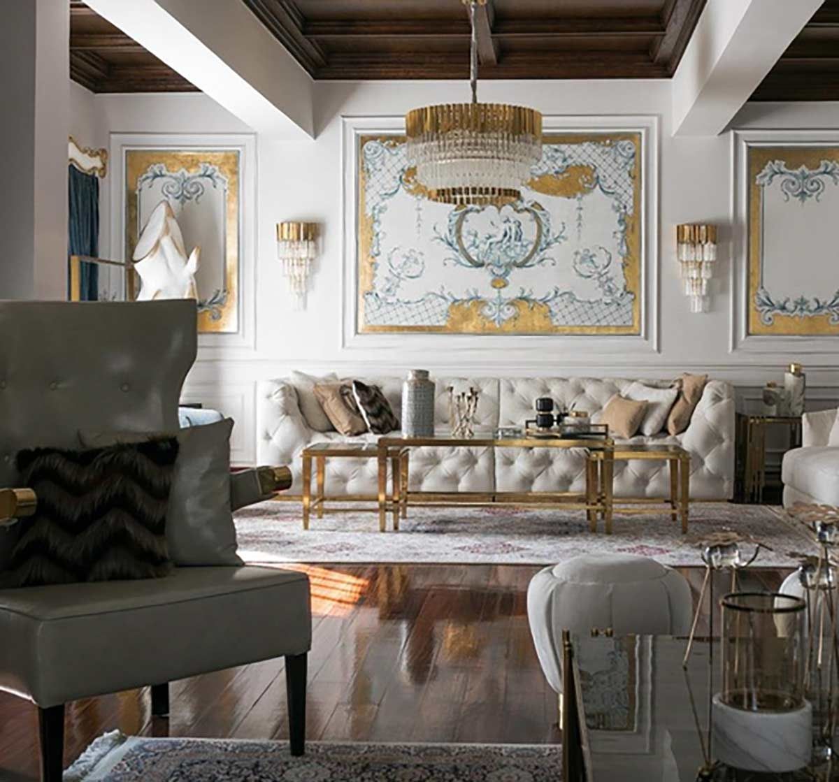 A living room with a couch , chairs , and a table