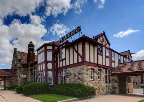 a large building with a lot of windows and a sign that says ' ain ' on it .