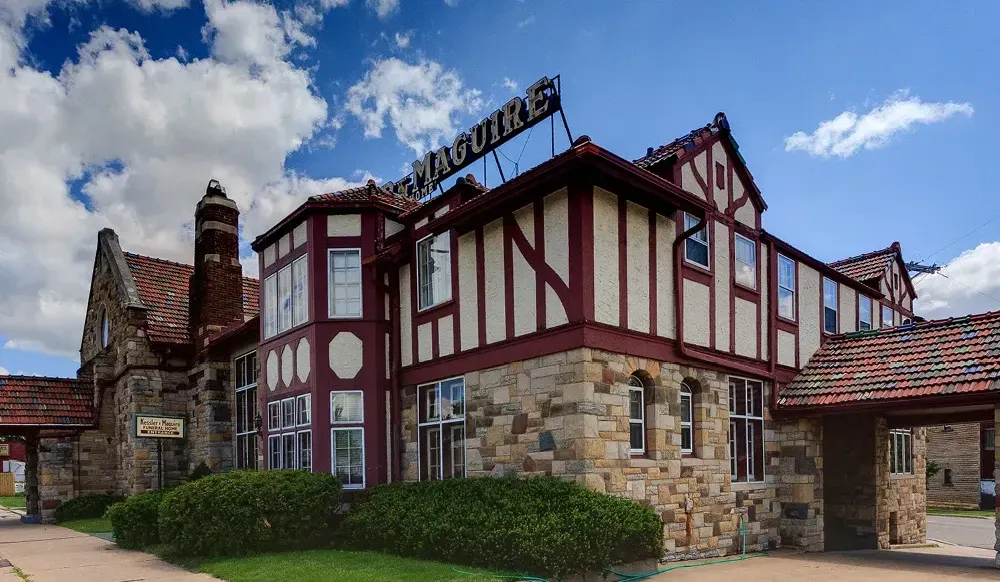 a large building with a lot of windows and a sign that says ' ain ' on it .