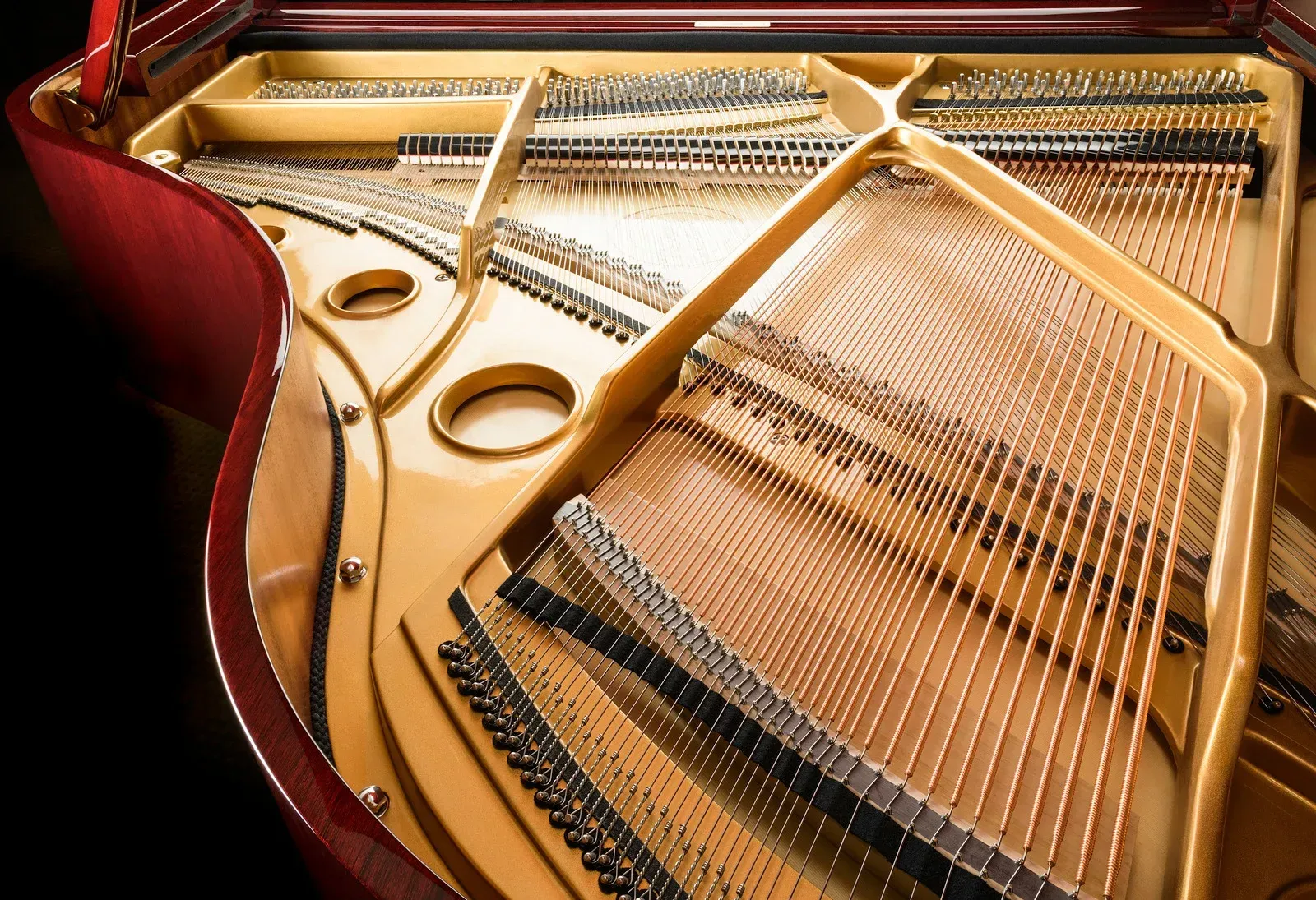 A close up of the inside of a grand piano