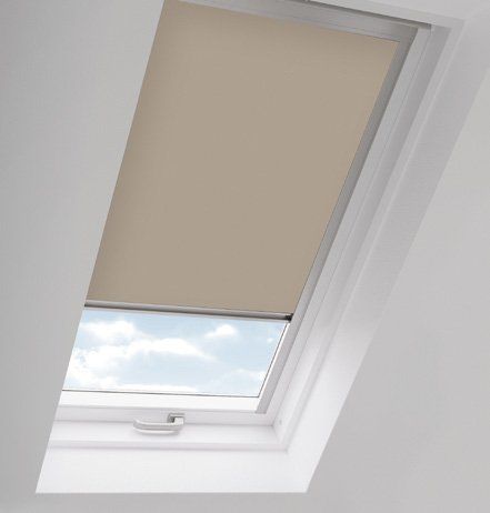 A picture of a skylight with a blind on it.