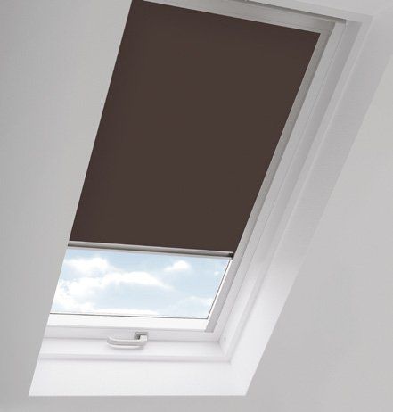 A skylight with a brown blind on it