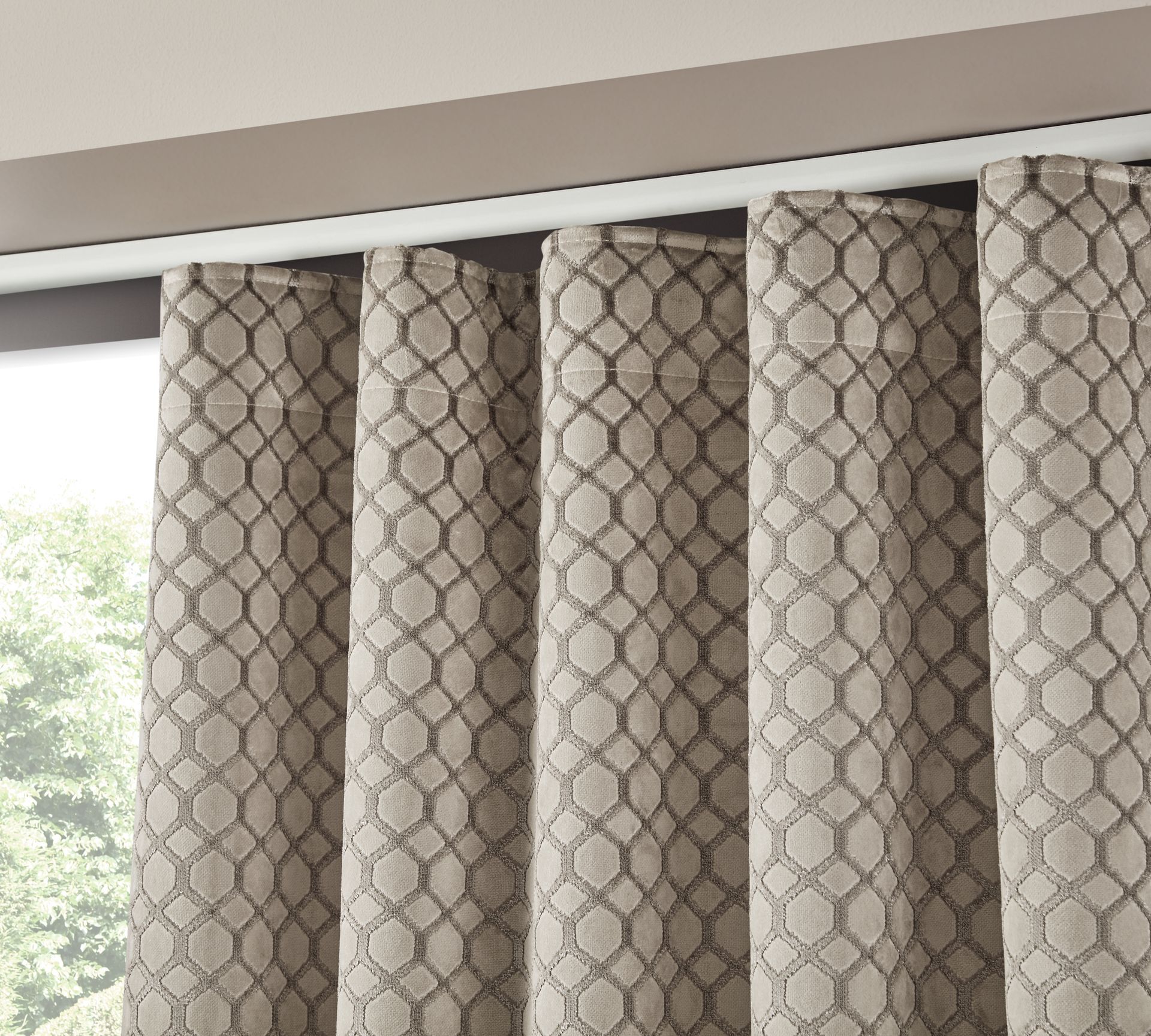 A close up of a curtain with a pattern on it