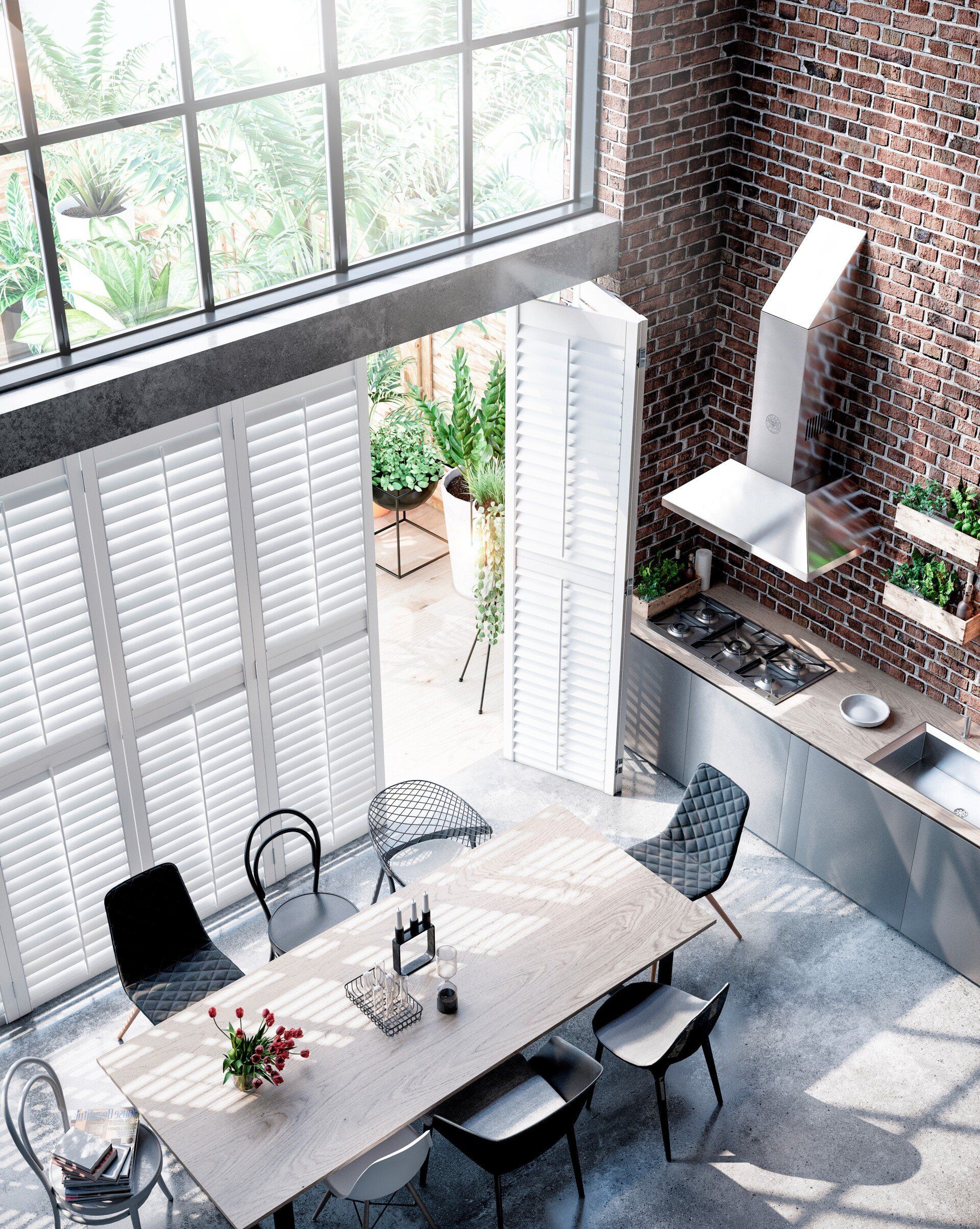 An aerial view of a kitchen with a large table and chairs.