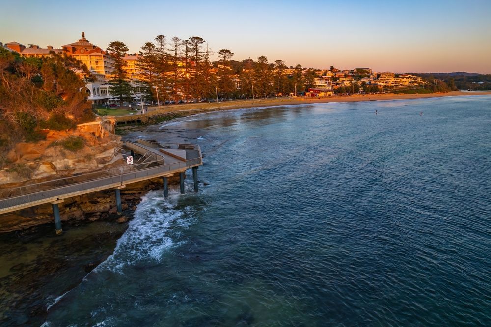 An Aerial View Of A Pier Overlooking A Body Of Water — Coastal Protection Services Pty Ltd In Killarney Vale, NSW