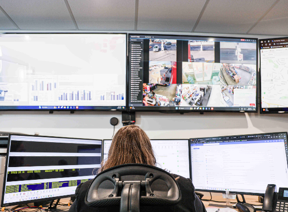 A Security Personnel Is Looking at the Computer Monitors — Coastal Protection Services Pty Ltd In Long Jetty, NSW