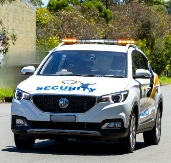 Security Officer Holding His Hands Behind His Back — Coastal Protection Services Pty Ltd In Hamlyn Terrace, NSW
