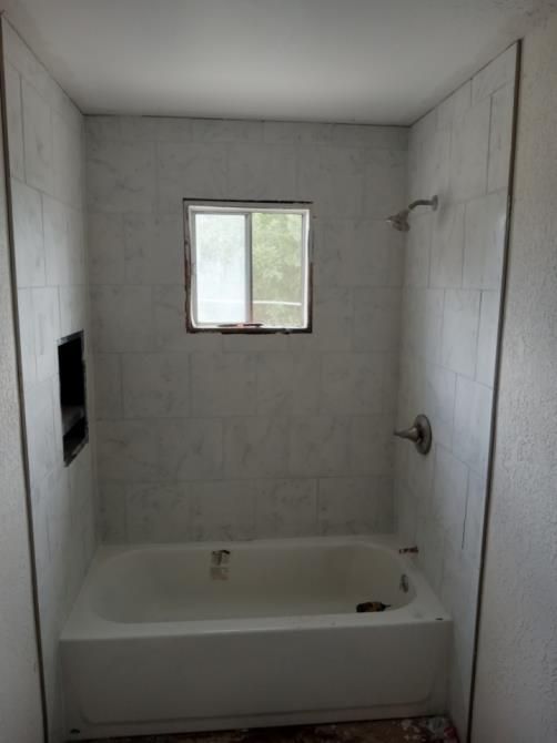 Interior of an attic during the drywall spackling and plastering phase.