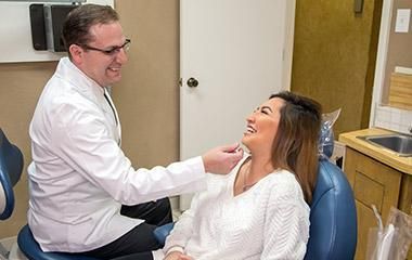 Dr. Warren performs an oral screening as a routine part of all new patient exams.