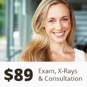 A woman is smiling for a picture with the price of $ 89 for exam , x-rays and consultation.