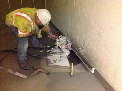 Worker Sawing Concrete Wall - Concrete Sawing Services in Milton, WA