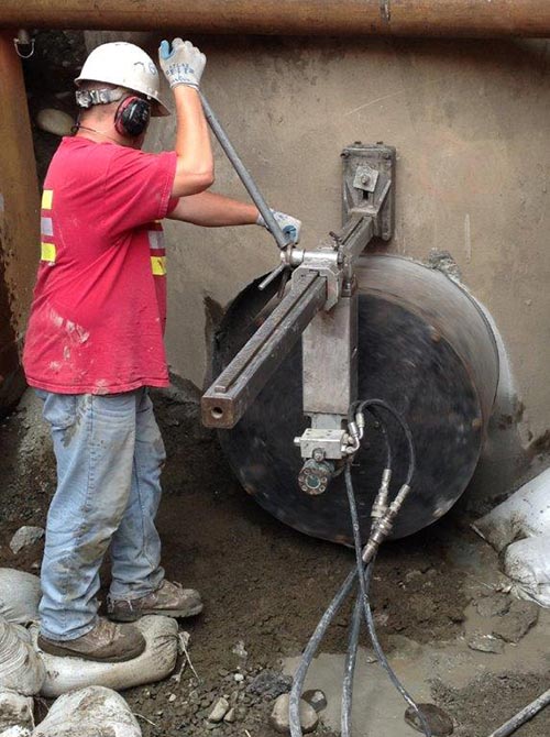 Worker cutting hole in concrete - Concrete drilling in Milton, WA