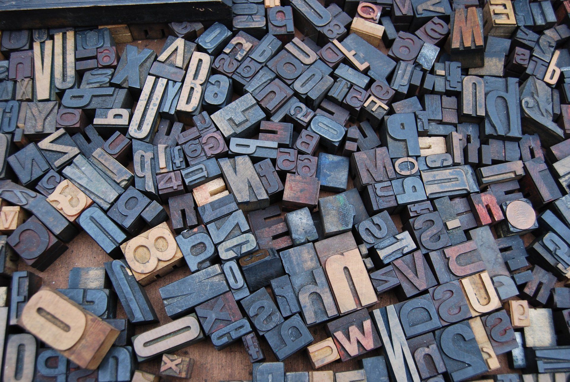 a bunch of letters and numbers are laying on a table