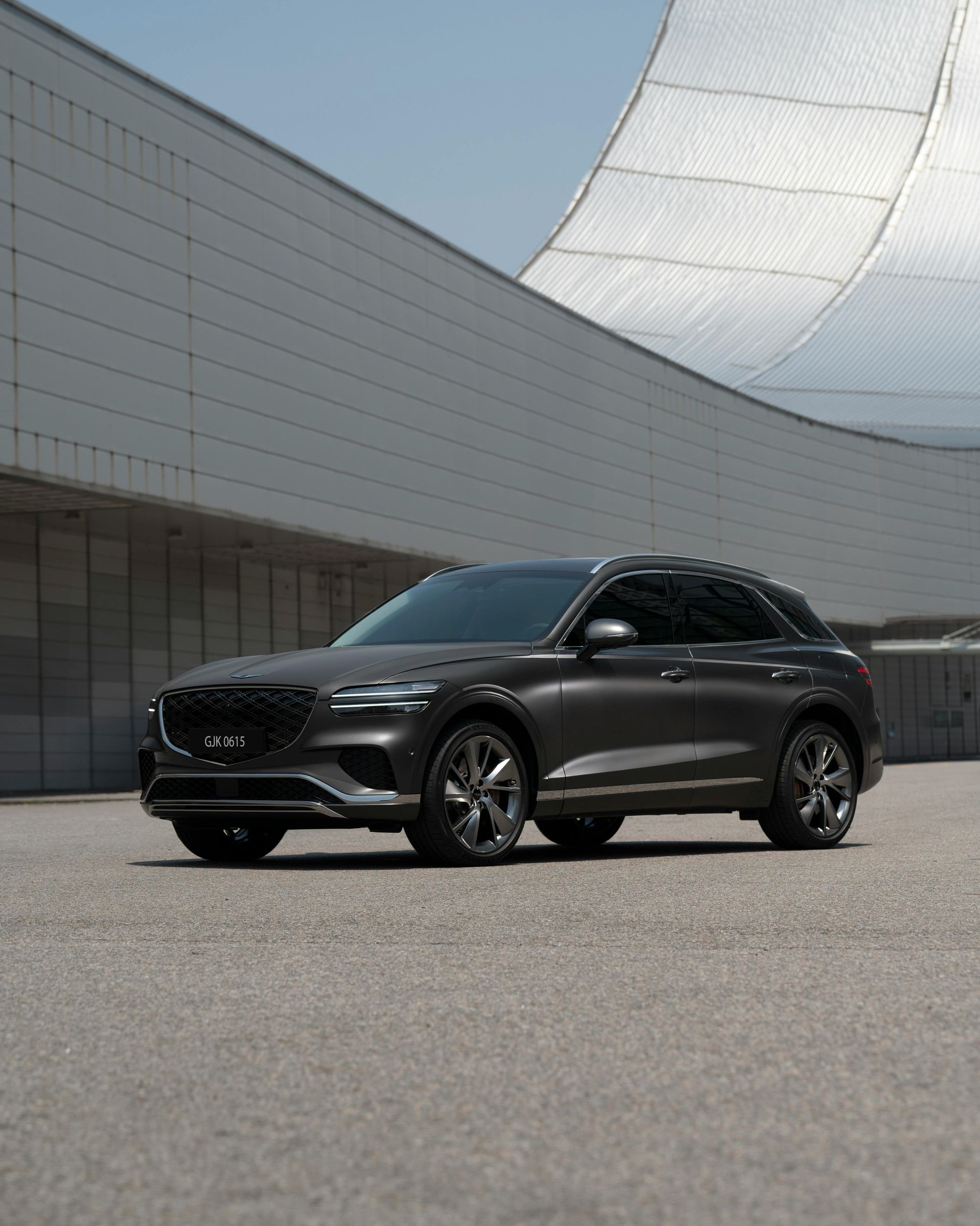 Mid-century modern credenza with a lamp and decorative objects, in a sunlit room.