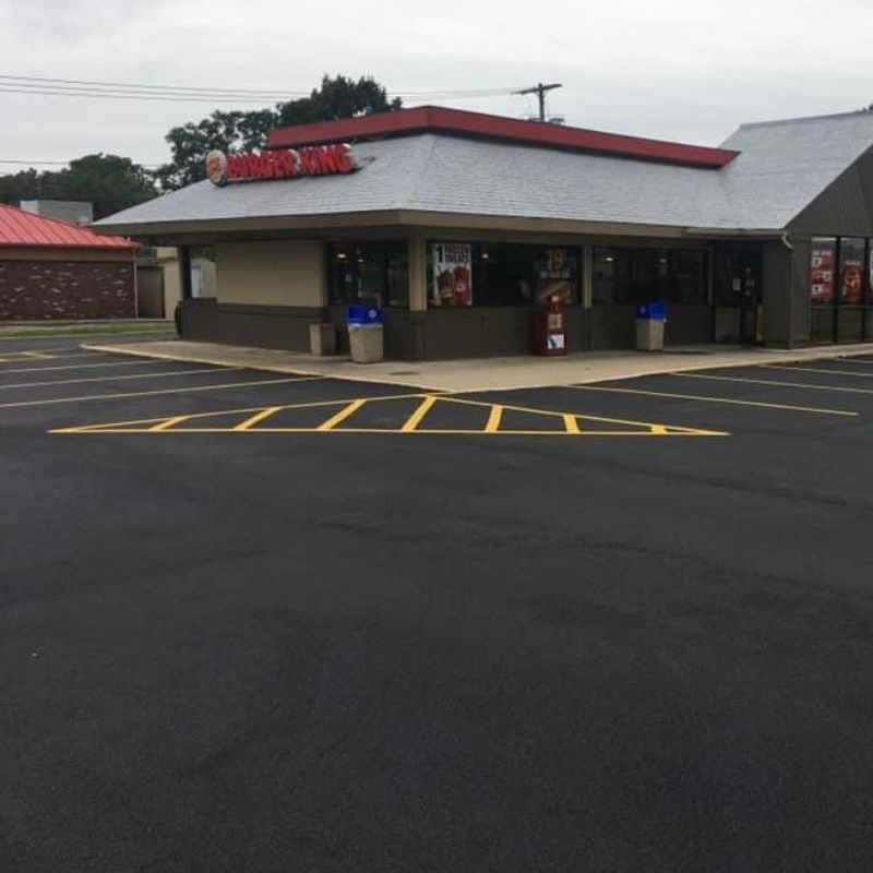 Commercial paving project by Universal Paving & Concrete in Rochester, NY, showcasing durable and smooth asphalt surface for business parking lots.