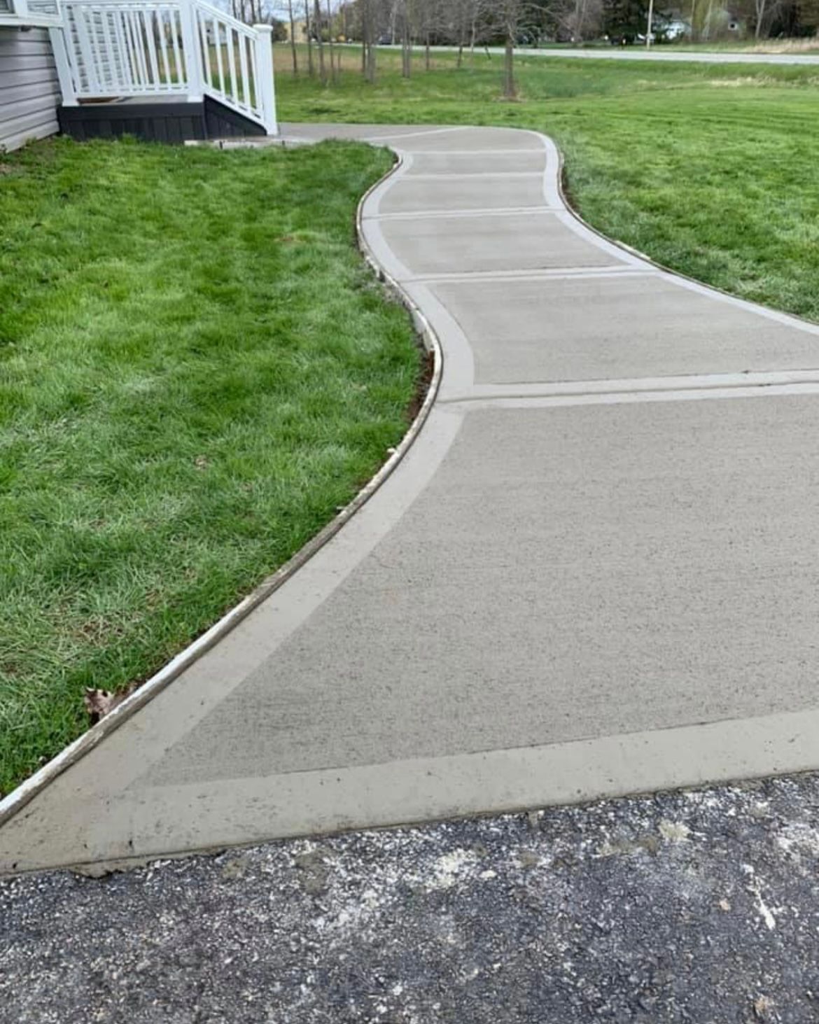 Brushed concrete walkway installation by Universal Paving & Concrete in Rochester, NY, designed for durability and slip resistance, perfect for high-traffic areas.
