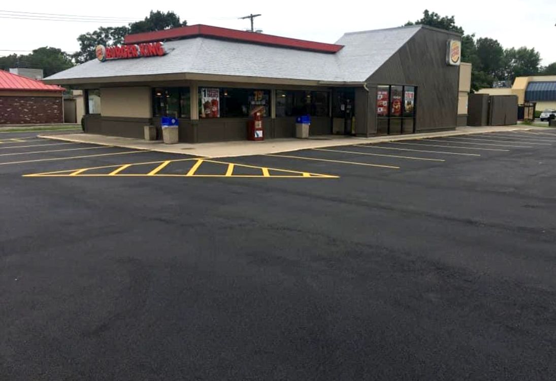 Universal Paving & Concrete team working on commercial paving for a large-scale project in Rochester, NY, delivering quality and efficiency.