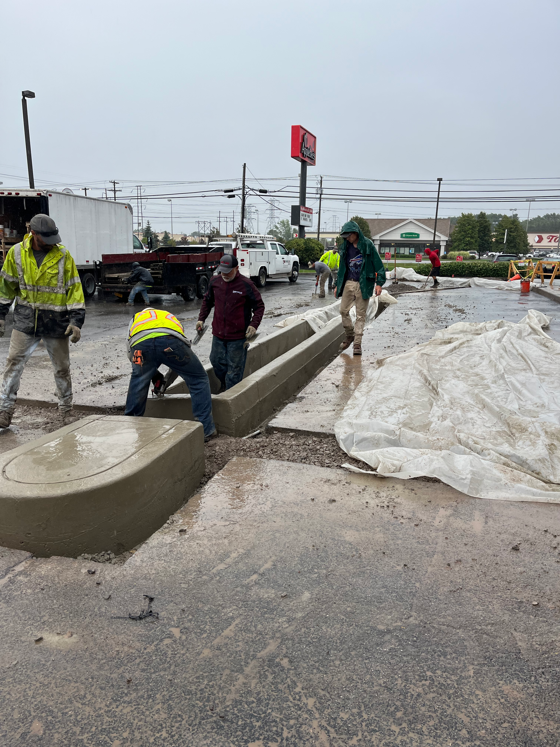 Commercial parking lot paved by Universal Paving & Concrete in Rochester, NY, providing a smooth, durable surface for business use and customer traffic.