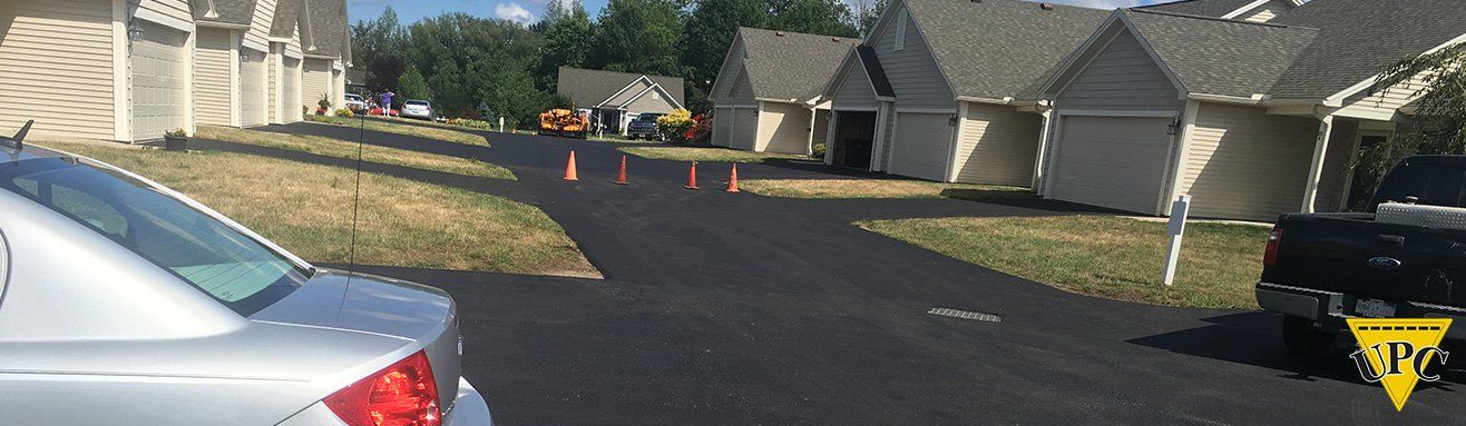 Universal Paving & Concrete installing high-quality commercial paving for a business property in Rochester, NY, ensuring long-lasting performance and durability.