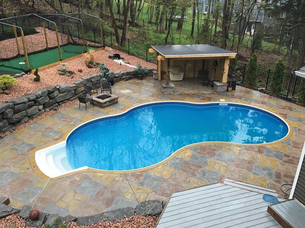 Aerial view of a custom-stamped concrete patio with a seamless, elegant design, installed by Universal Paving & Concrete in Rochester, NY.