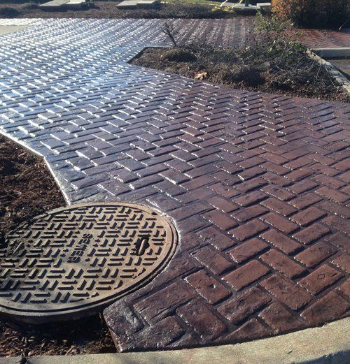 Close-up of textured stamped concrete surface on a patio installed by Universal Paving & Concrete in Rochester, NY.