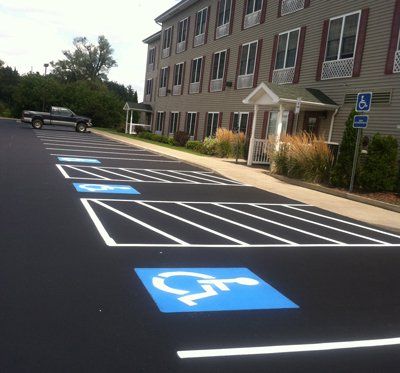Commercial ADA-compliant paving project by Universal Paving & Concrete in Rochester, NY, featuring accessible ramps and smooth surfaces for wheelchair access.