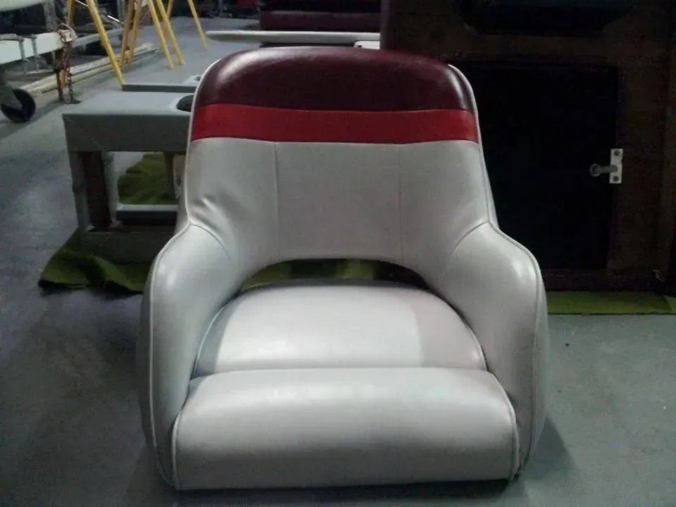 A white chair with a red stripe on the back