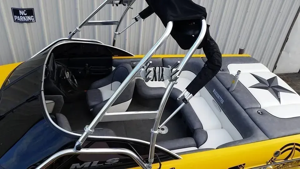 A yellow and gray boat with a star on the side