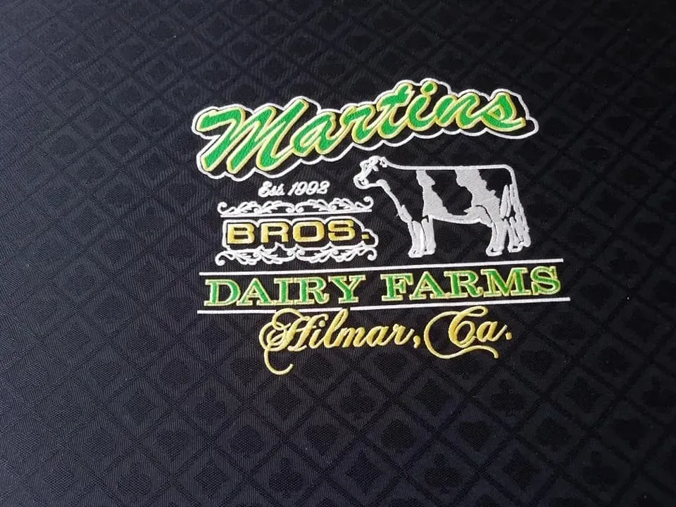 A logo for martin 's bros dairy farms hilmar ca
