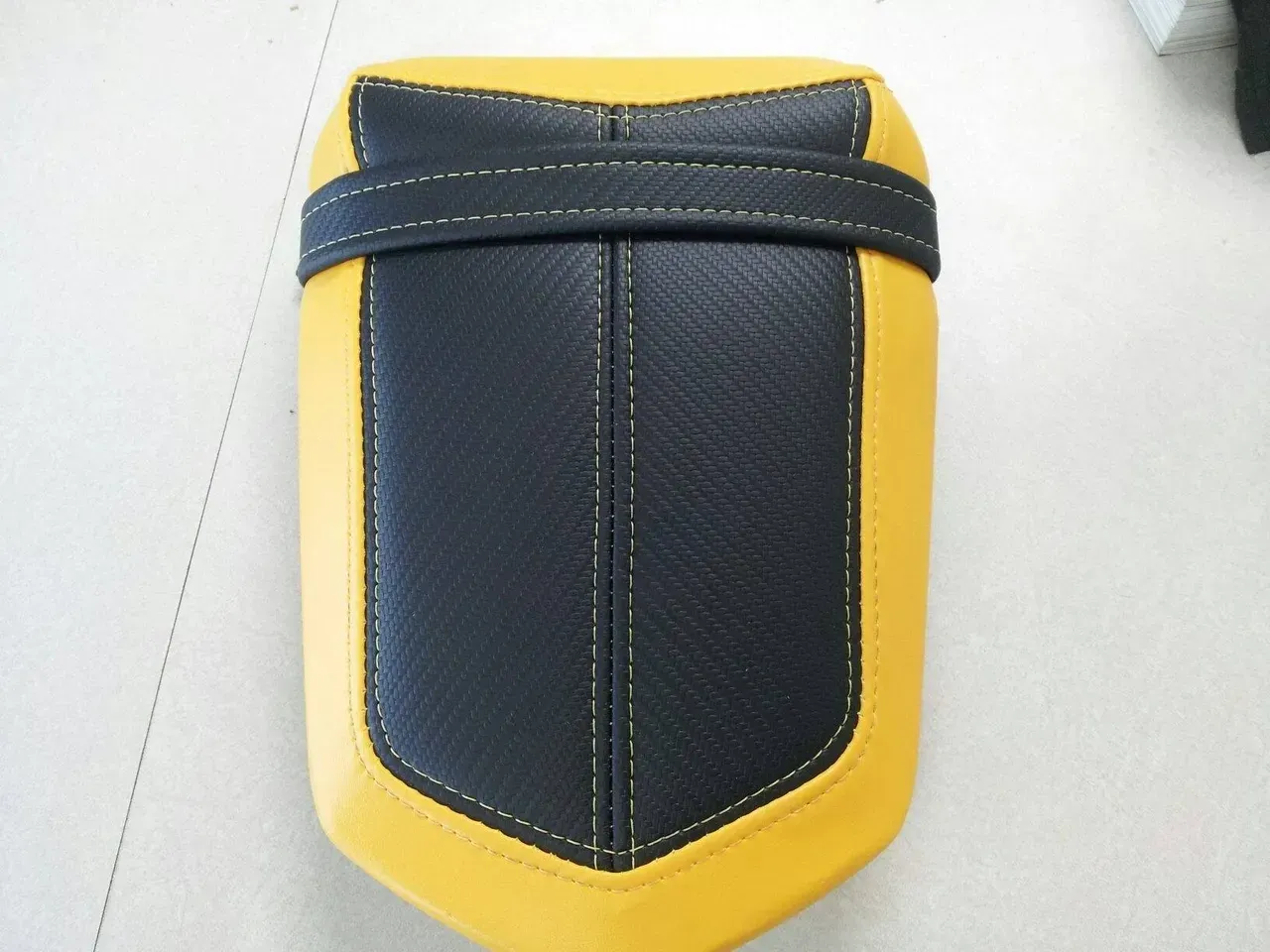 A yellow and black item is sitting on a table