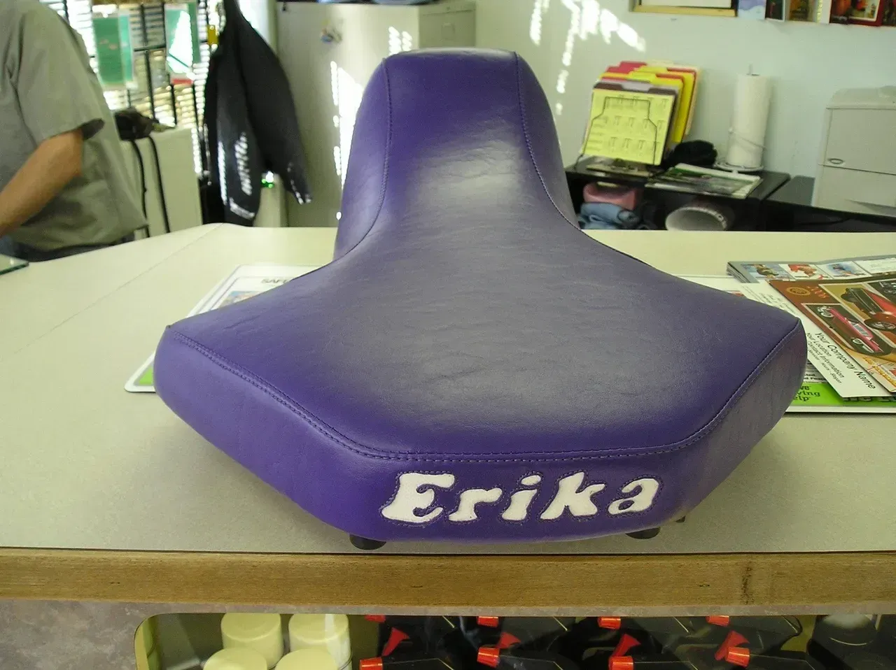 A purple seat with the name erika on it