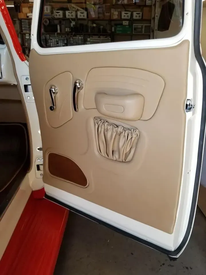 A close up of a car door with a pocket on it.