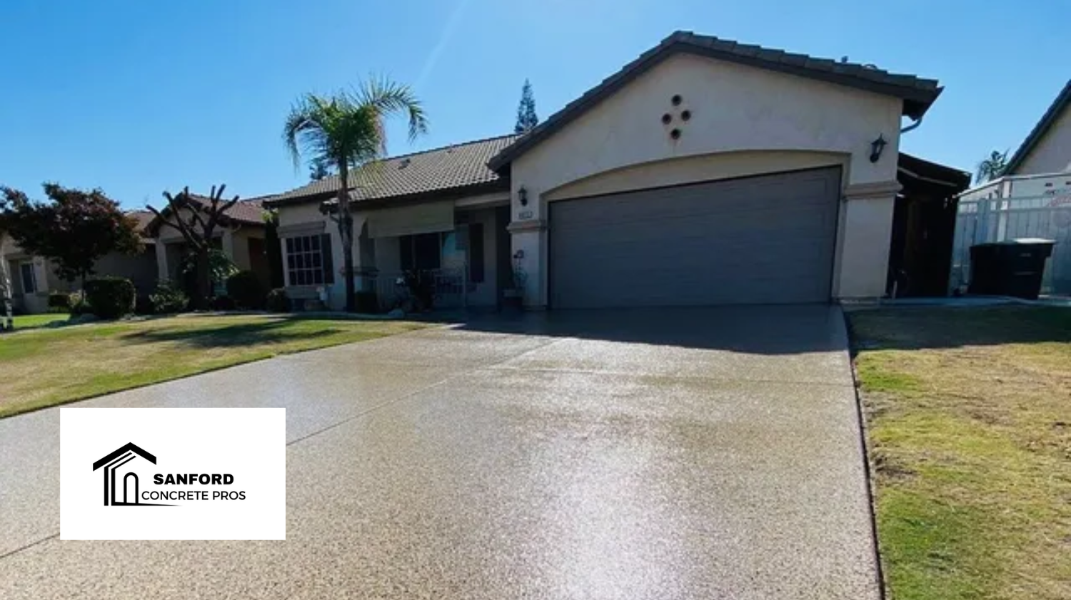 A picture of a house with a driveway in front of it