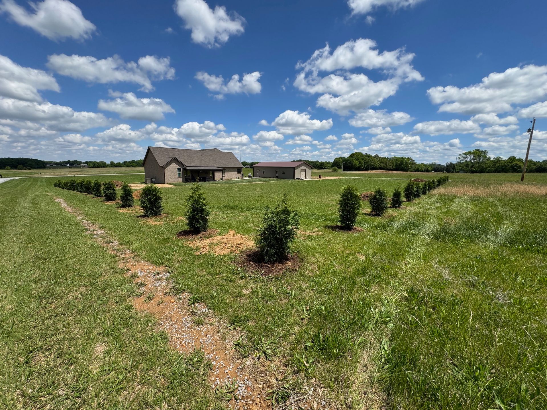 A brick house with a walkway leading to it
