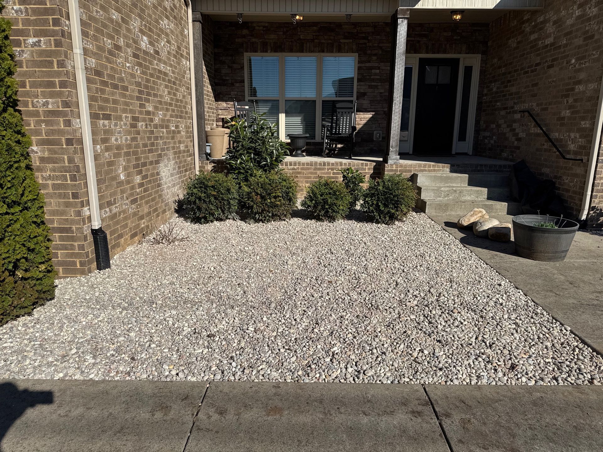 A brick house with a walkway leading to it