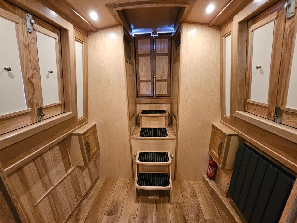 Celia May steps to stern from bike room