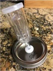 airlock assembled on wide mouth mason jar lid