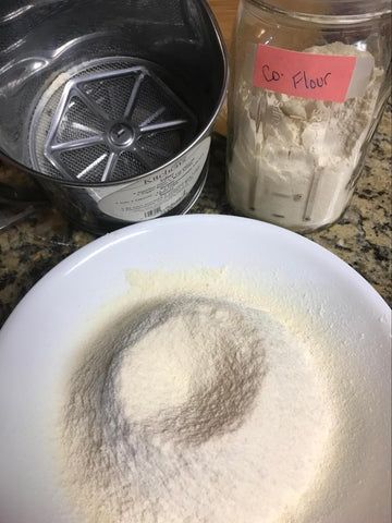 sifted flour in a white bowl
