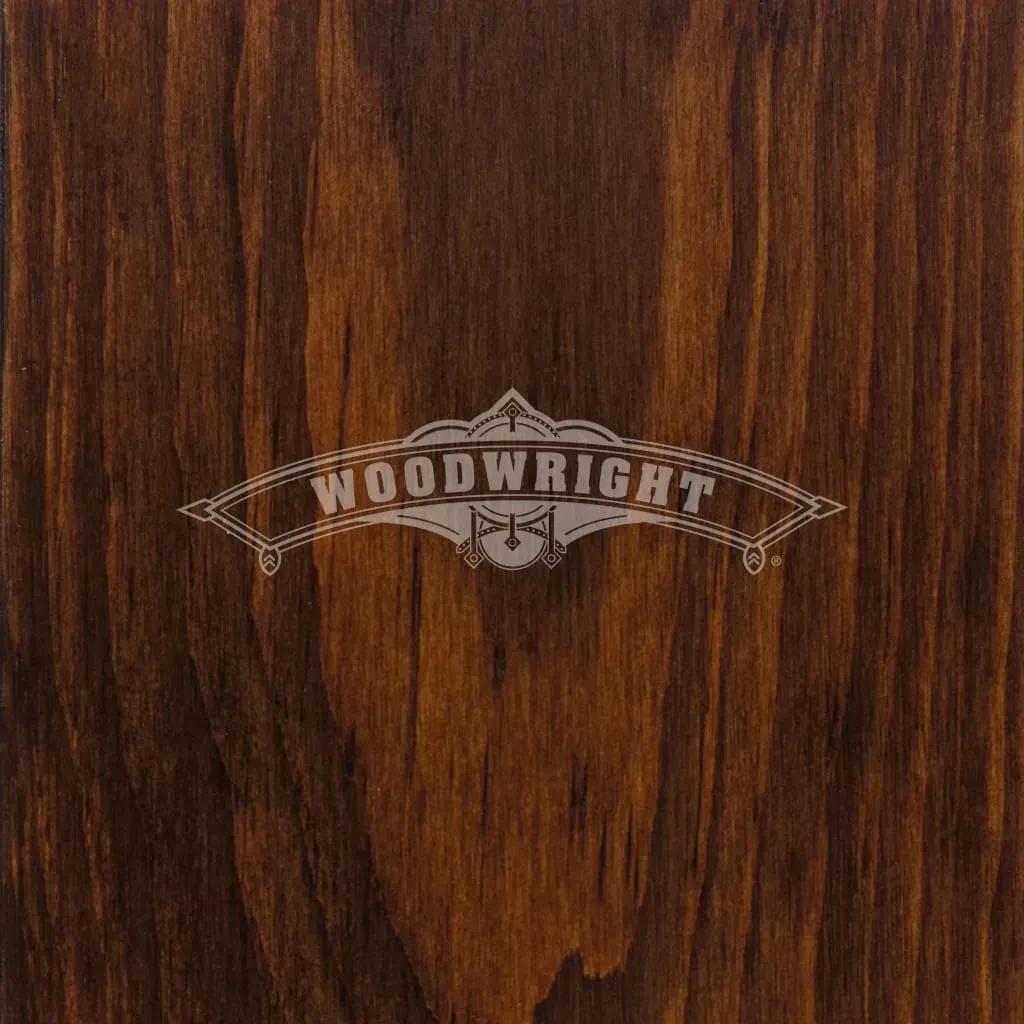 Woodwright logo on stained wood background. Brown wood grain with decorative logo.