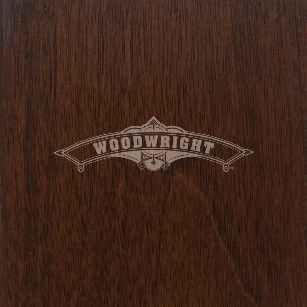 Dark brown woodgrain surface with the word 