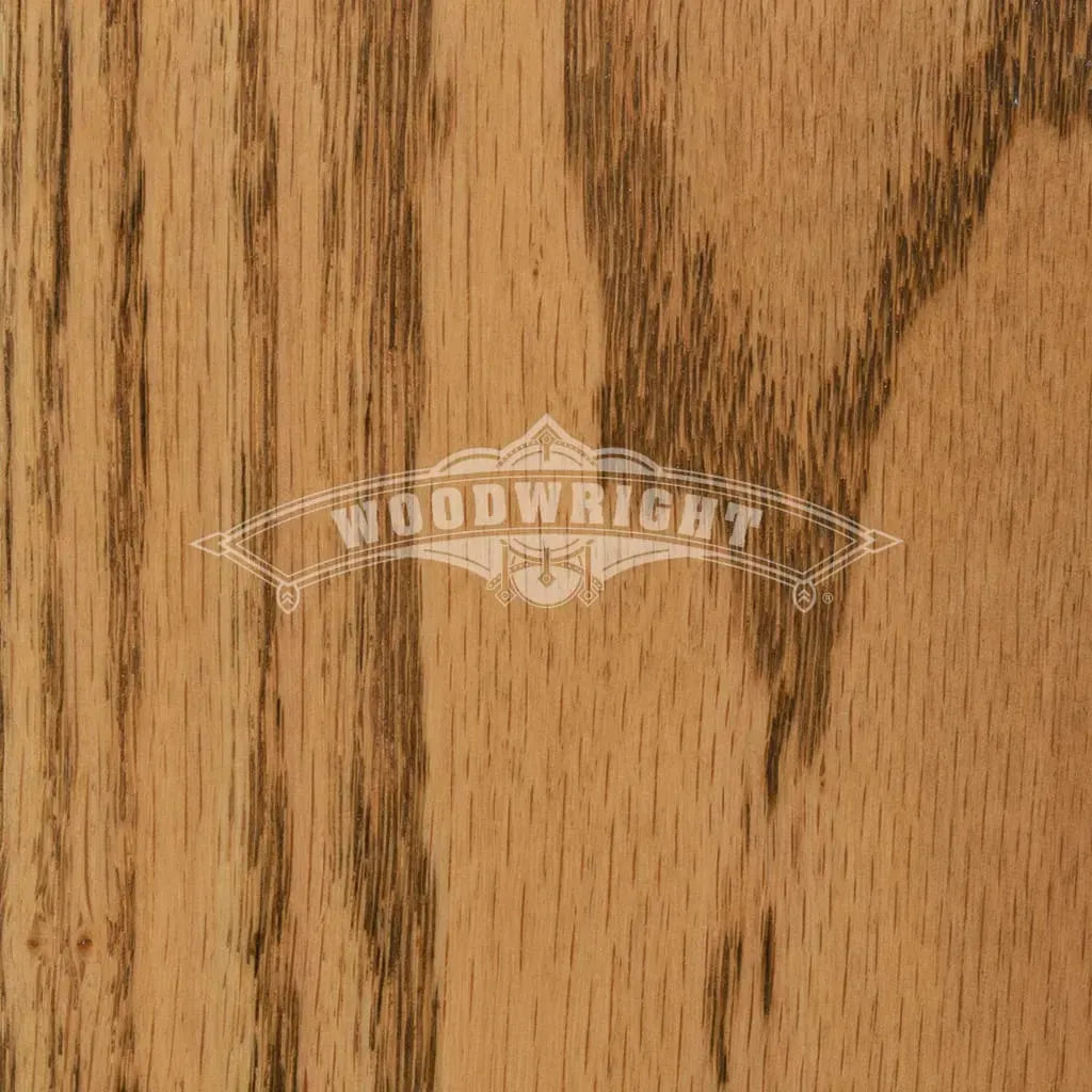 Close-up of oak wood grain with “WOODWRIGHT” logo. Tan and brown vertical streaks.