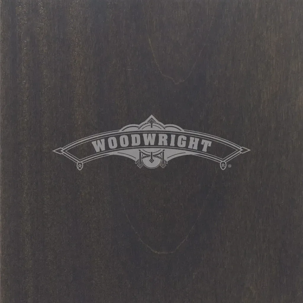 Woodwright logo on dark wood background.