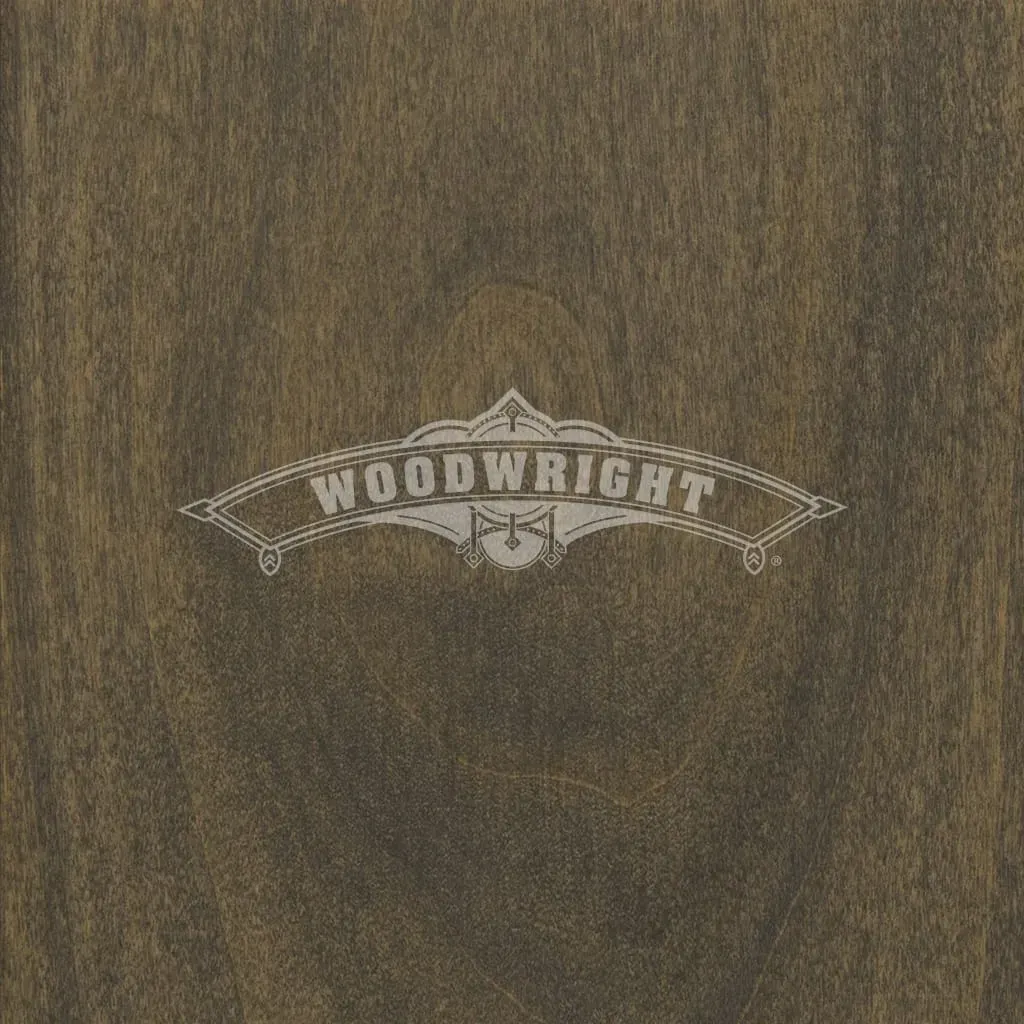 Woodwright logo on a brown wood surface.