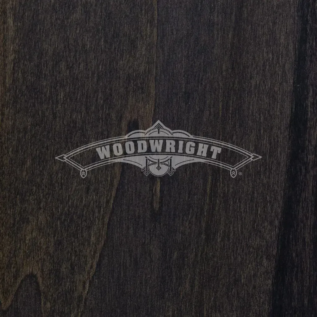 Logo for Woodwright on a dark wooden surface.