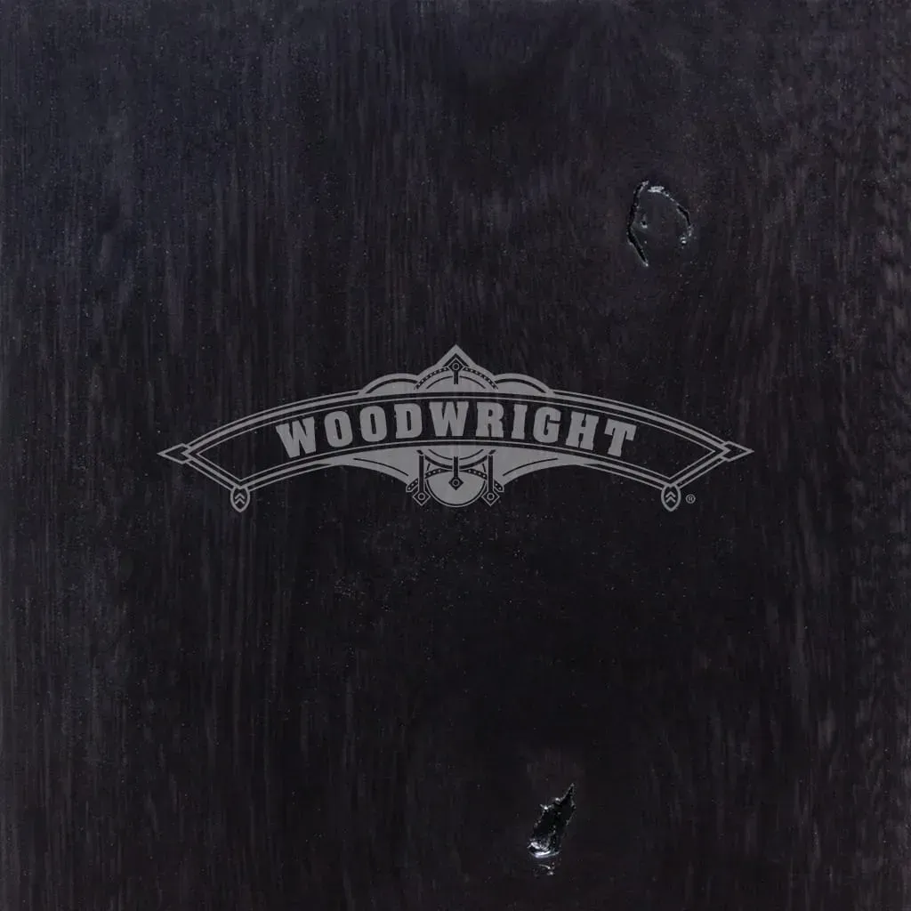 Black wooden surface with a silver 