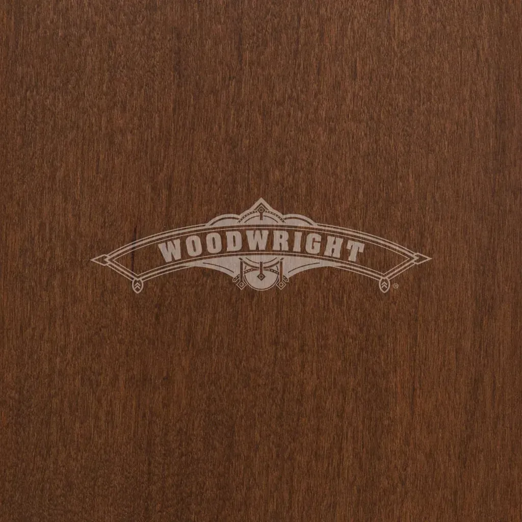 Woodwright logo etched in light color on a dark brown wood grain background.