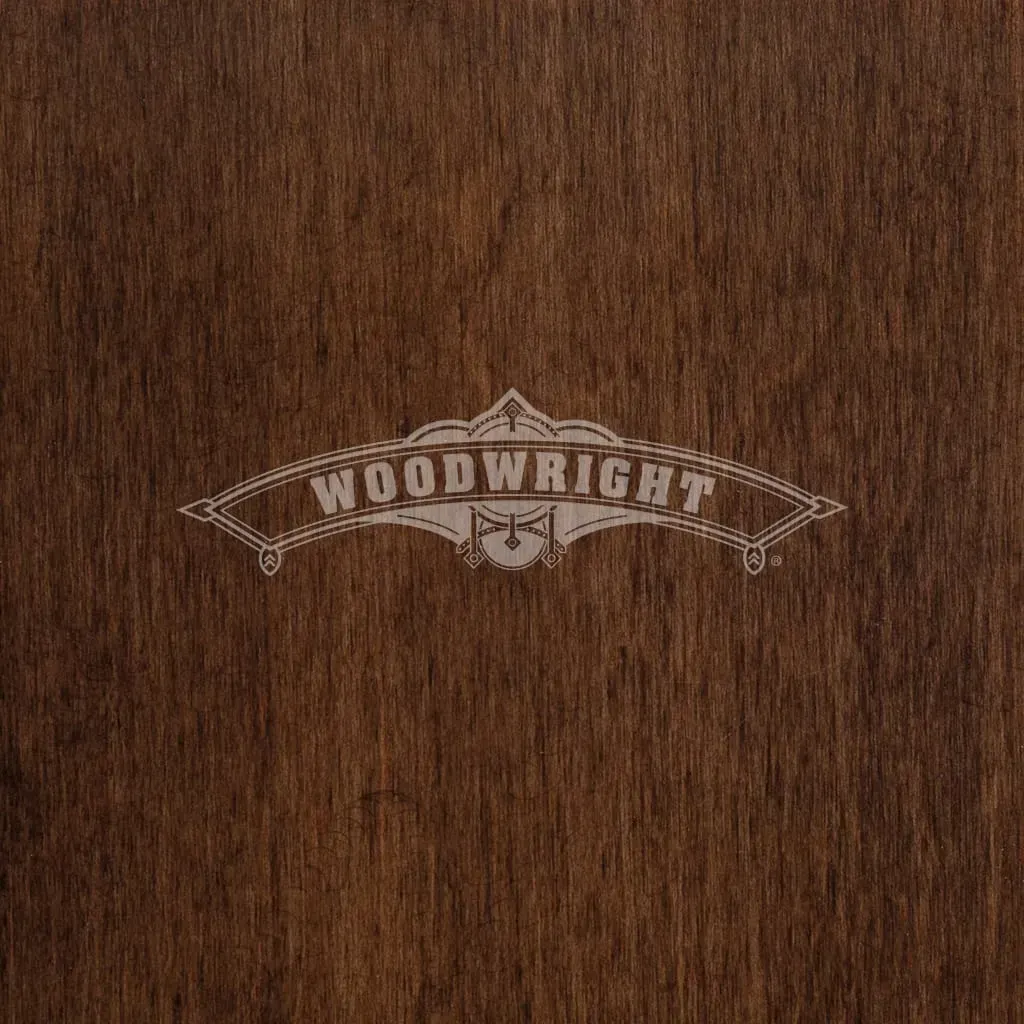Woodwright logo on dark wood background.