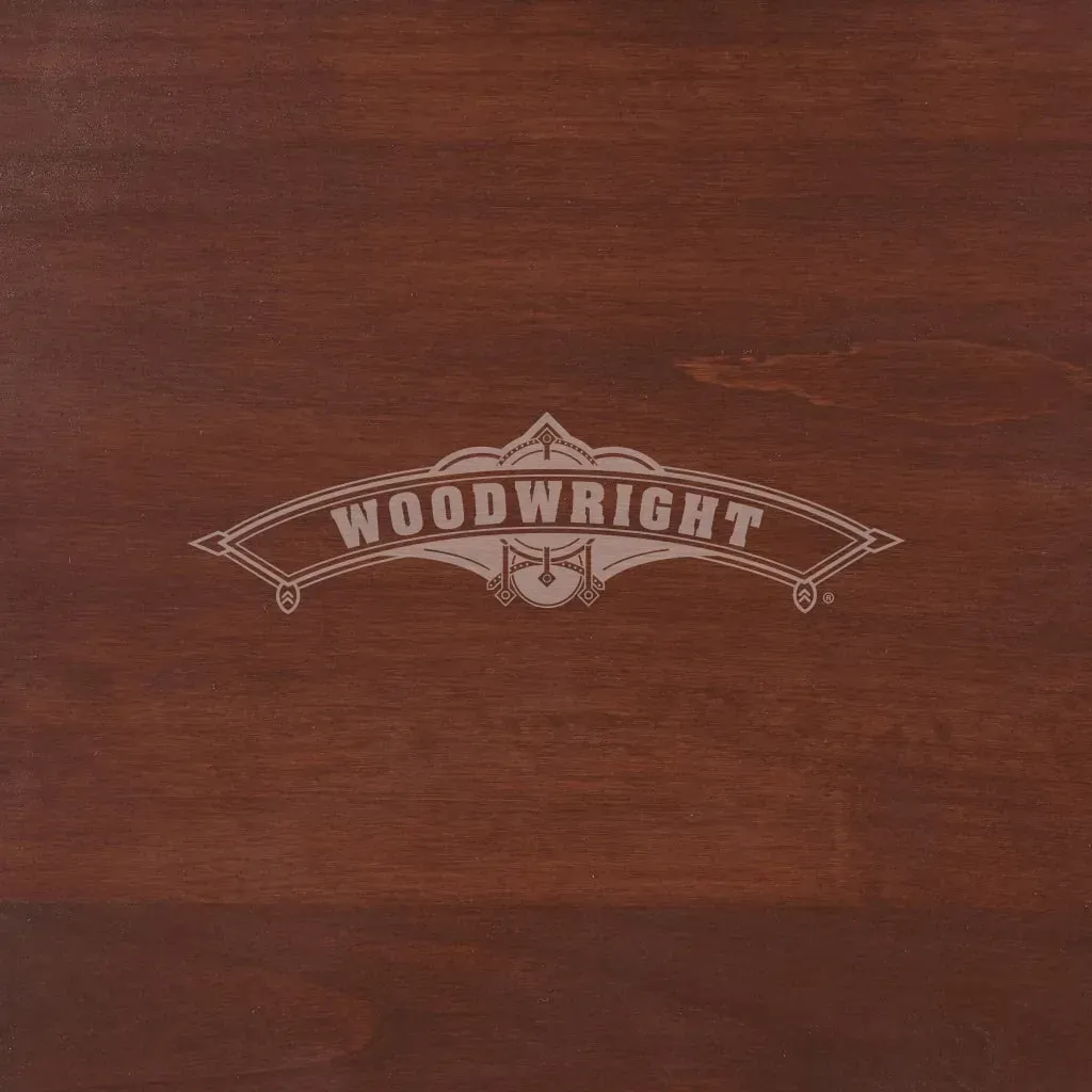 Woodwright logo on a dark wood surface.